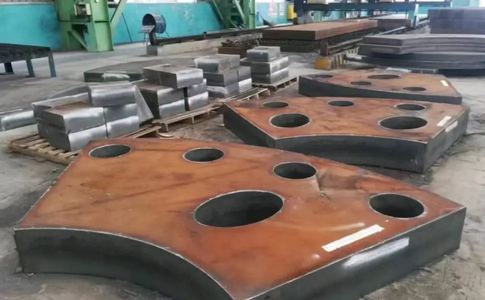 Gusset plates with bored holes cut from bridge-quality steel plate