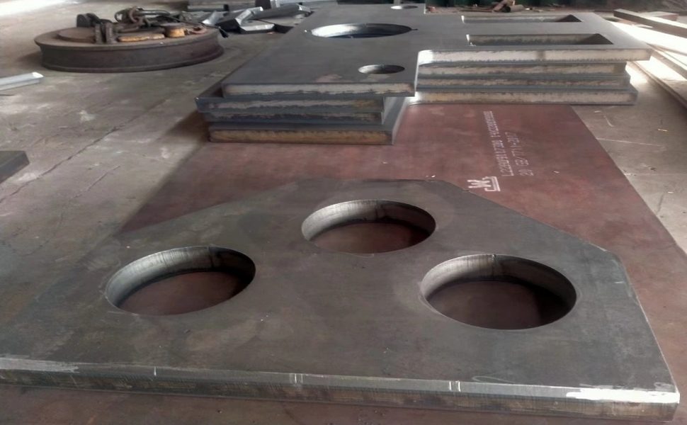Plates and discs cut from steel plate stacked in the workshop