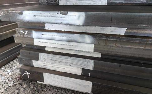 Stack of cryogenic steel plates with heat number and specification stencilled on each edge